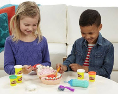 Children playing with Play-Doh Doctor Drill and Fill