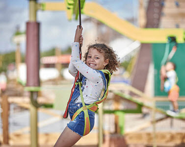 Girl on zip wire at Haven Hafan Y Mor